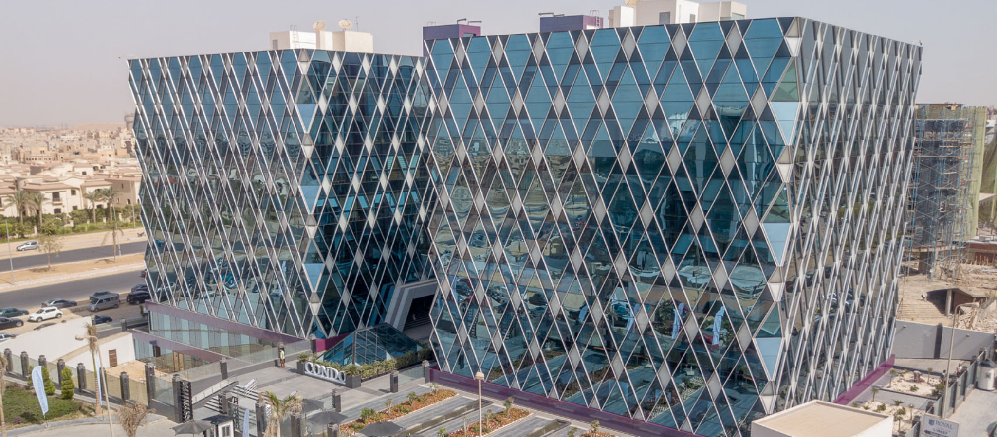 Aerial view of a modern urban development in New Cairo, Egypt, representing the growth of tech startup hubs and real estate demand corridors.